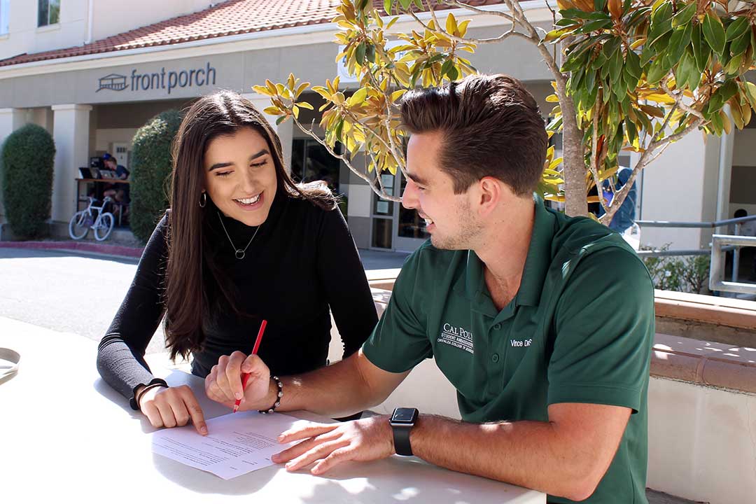 Front Porch, San Luis Obispo, Oct. 14, 2019｜Journalism senior Megan LaChance and business administration senior Vince DeSantis sit together outside of San Luis Obispo’s Front Porch. LaChance and DeSantis are tackling the all-important task of editing LaChance’s resumè. DeSantis is an Orfalea College of Business Peer Mentor and Student Ambassador and has helped fellow students with career readiness in those roles. Before he begins editing, he asks LaChance, “What do you like best about your resumè?